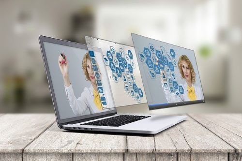 Agent working on laptop—professional real estate web design concept