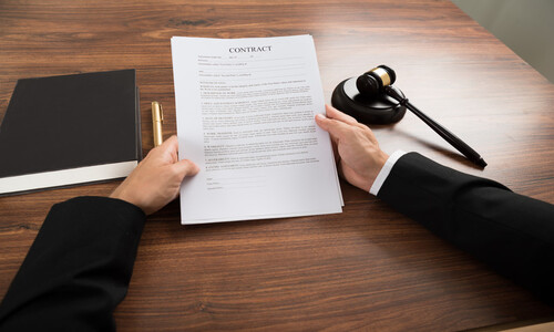 Real estate contract paperwork and agreement signing